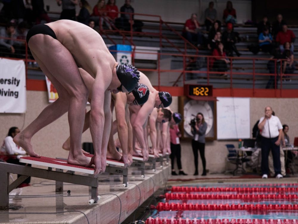 Swimmers prepare to enter the water at the Ball State v. Evansville meet at the Lewellen Pool Jan. 18, 2019. Jack Hart, DN