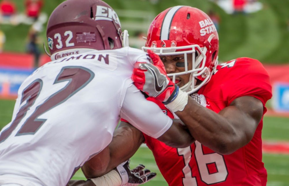 <p>KeVonn Mabon, a wide receiver for the Ball State Cardinals, pushes past Eastern Kentucky&nbsp;cornerback Buck Solomon in the home opener&nbsp;on Sept. 17 in&nbsp;Scheumann Stadium. Ball State won 41-14. <em>Grace Ramey // DN</em></p>