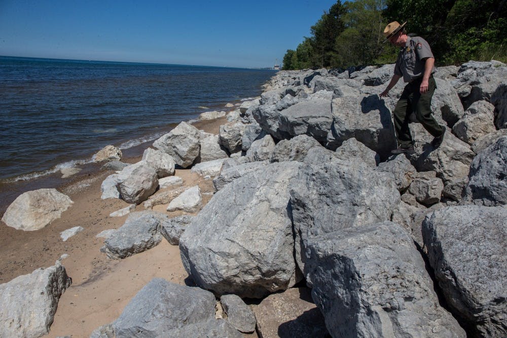 Bruce Rowe, park ranger with the National Park Service, walks down on a riprap built to prevent beach erosion at the Indiana Dunes National Lakeshore near Beverly Shores, June 6, 2014. MCT PHOTO