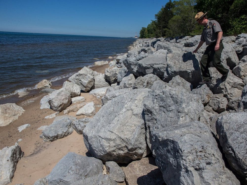Bruce Rowe, park ranger with the National Park Service, walks down on a riprap built to prevent beach erosion at the Indiana Dunes National Lakeshore near Beverly Shores, June 6, 2014. MCT PHOTO