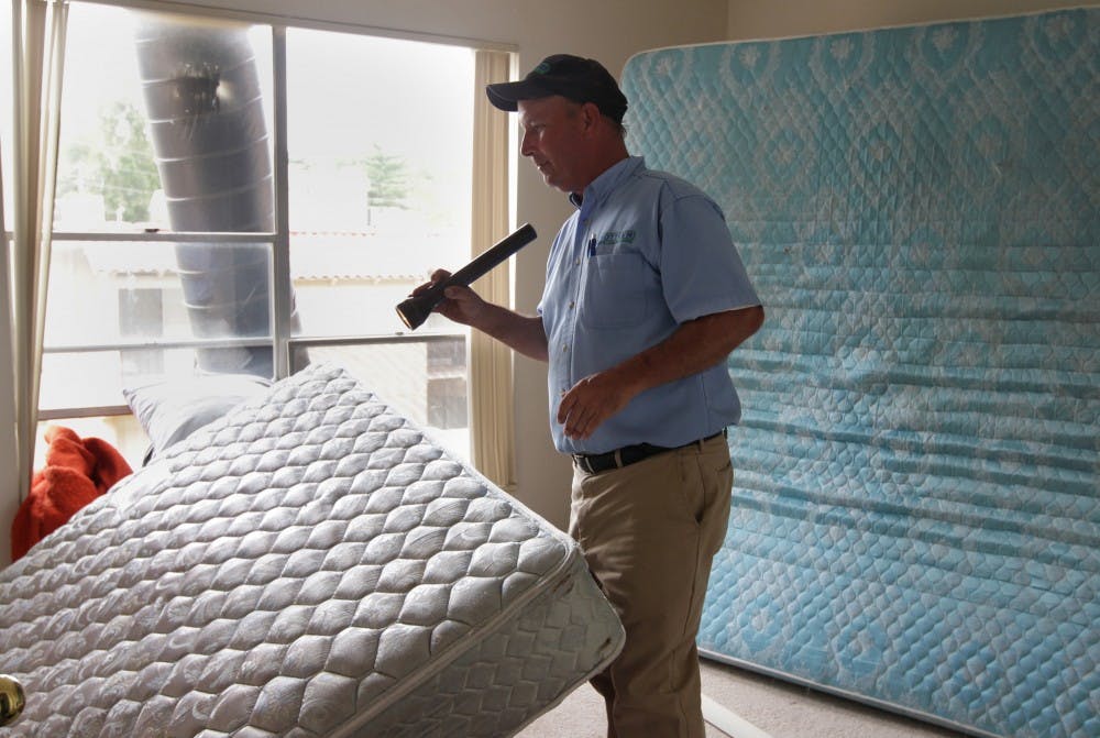 Joe Wells of Rottler Pest & Lawn Solutions  looks around a home he is using a bed bug heat treatment in west St. Louis county, Missouri, Tuesday, September 7, 2010. Heat treatment is an environmentally friendly method for eradicating bed bugs and does not utilize any pesticides or chemicals. (Stephanie S. Cordle/St. Louis Post-Dispatch/MCT)