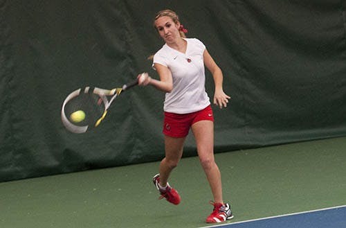 Sophomore Courtney Wild returns a serve. DN PHOTO BOBBY ELLIS