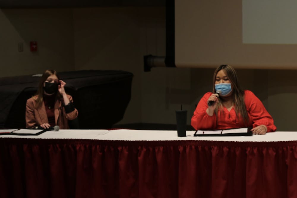 Monet Lindstrand and Tina Nguyen answer questions at the third Student Government Association (SGA) debate Feb. 17 at Pruis Hall. Students attending the debate were encouraged to ask questions about issues that concerned them. Richard Kann, DN