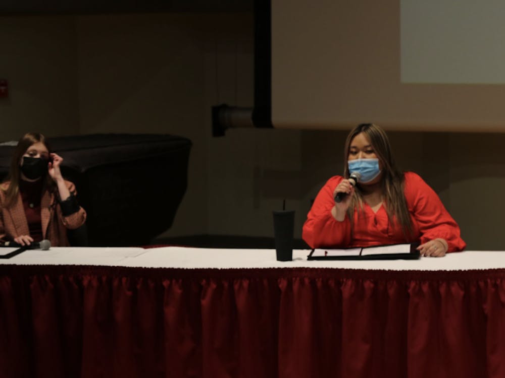 Monet Lindstrand and Tina Nguyen answer questions at the third Student Government Association (SGA) debate Feb. 17 at Pruis Hall. Students attending the debate were encouraged to ask questions about issues that concerned them. Richard Kann, DN