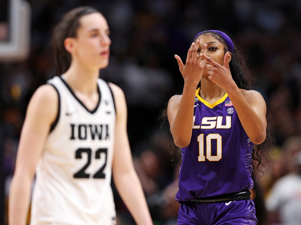 LSU's Angel Reese (10) gestures toward Iowa's Caitlin Clark (22) during the fourth quarter of the NCAA Tournament championship game at American Airlines Center on April 2, 2023, in Dallas. (Maddie Meyer/Getty Images/TNS)