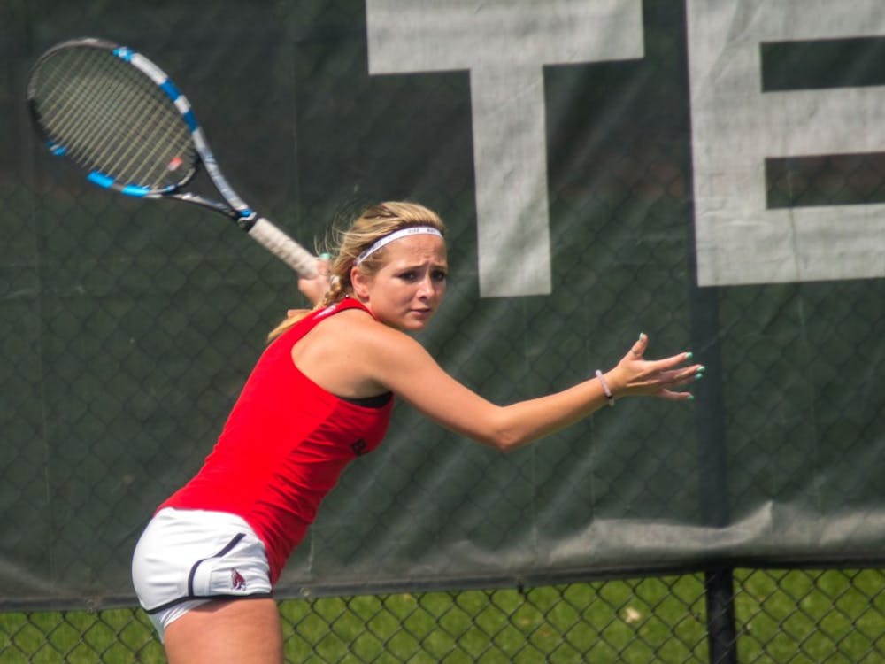 Junior Peyton Gollhofer gets ready to return the ball during the match against Buffalo on April 2, 2017 at the Cardinal Creek Tennis Center. Terence K. Lightning Jr., DN File