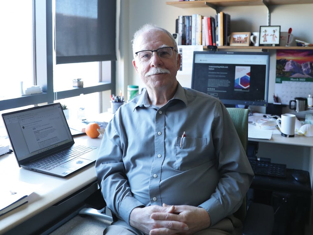 Professor of media Dom Caristi poses for a photo in his office March 1 in the Letterman Building. Caristi has worked at Ball State since 1998. Rylan Capper, DN