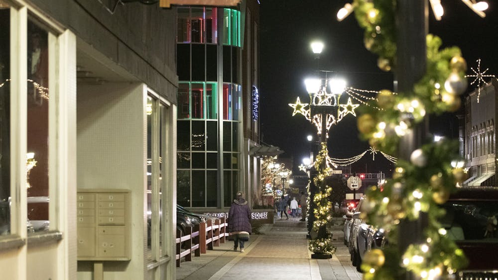 Canan Commons in downtown Muncie, Indiana, is lit up with warm festive colors Dec 1. This was a part of "LIGHT UP DWNTWN" as a part of the final First Thursday event of 2022. KwaTashea Marfo, DN
