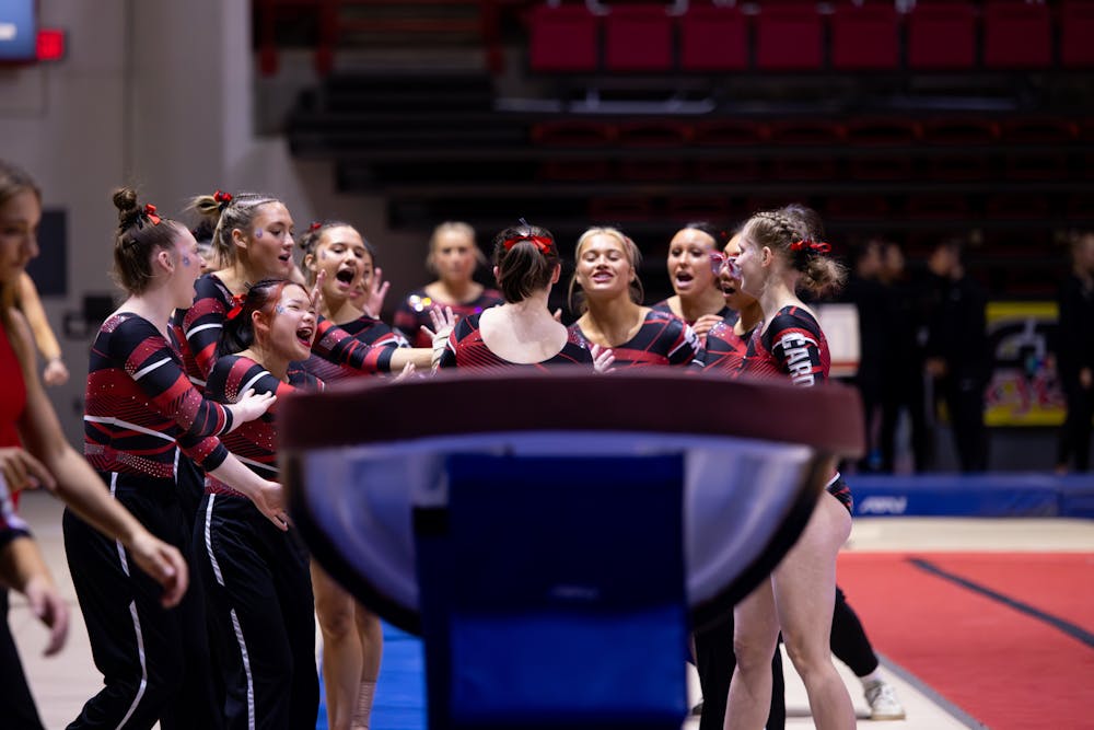 Ball State Gymnastics team congratulates their teammate, first-year Lindsay Girard on her vault routine. Girard scored a 9.700 on her routine at Worthen Arena in Muncie, IN on January 22, 2024. Eve Green DN