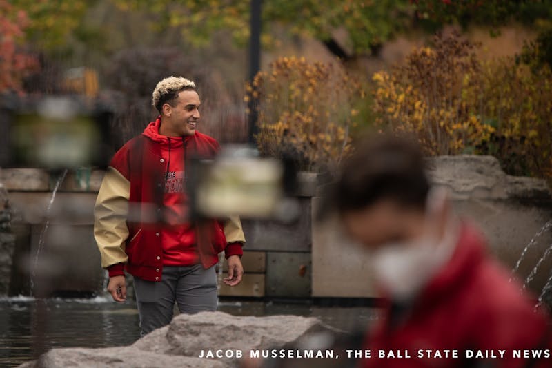 Ball State redshirt linebacker Brandon Martin stands in the Frog Baby fountain, Oct. 20, 2020, at Ball State University. Ball State Alumnus David Letterman and former Indianapolis Colts quarterback Peyton Manning were seen filming on campus by Frog Baby and at Scheumann Stadium. Jacob Musselman, DN