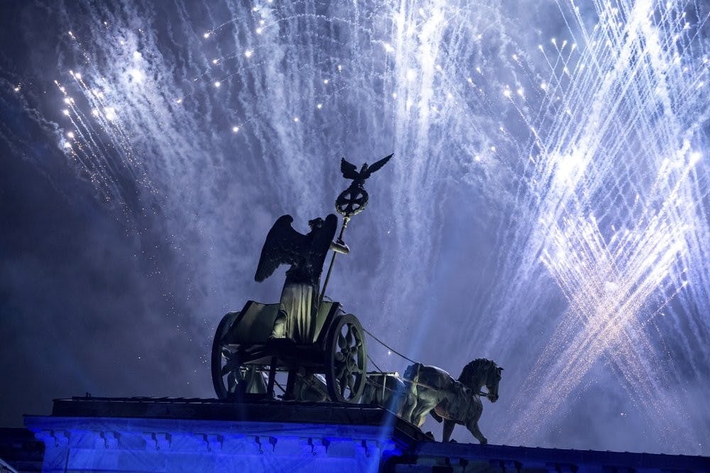 Fireworks are seen over the Brandenburg Gate as part of the 30th anniversary of the fall of the Berlin Wall in Berlin, Germany, Saturday, Nov. 9, 2019. (Bernd von Jutrczenka/dpa via AP)