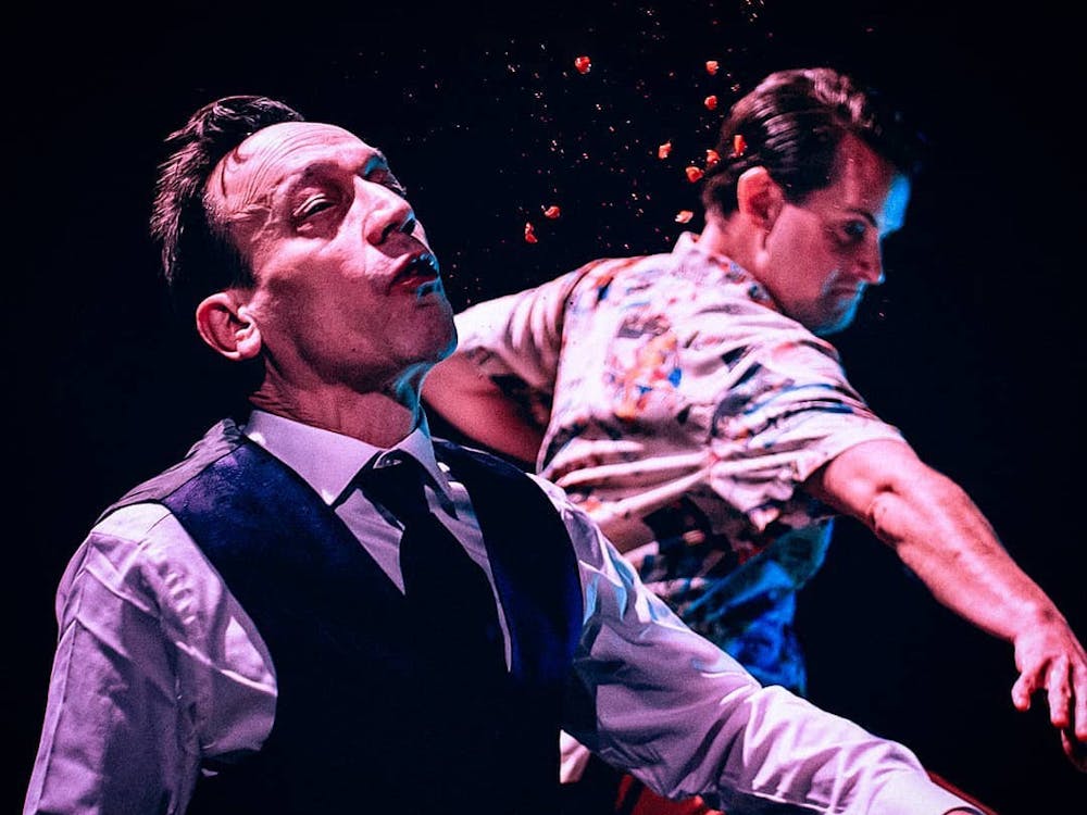 (From left to right) Actors Ted Raimi as Mr. Reggie and Alex Dunning as Briggs Sheridan interact during a scene from the movie "Popsy." The film directed by Ball State alumnus Jac Kessler has bagged five awards and eight nominations so far at national and international film festivals. Pale Moonlight Cinema, Photo Courtesy