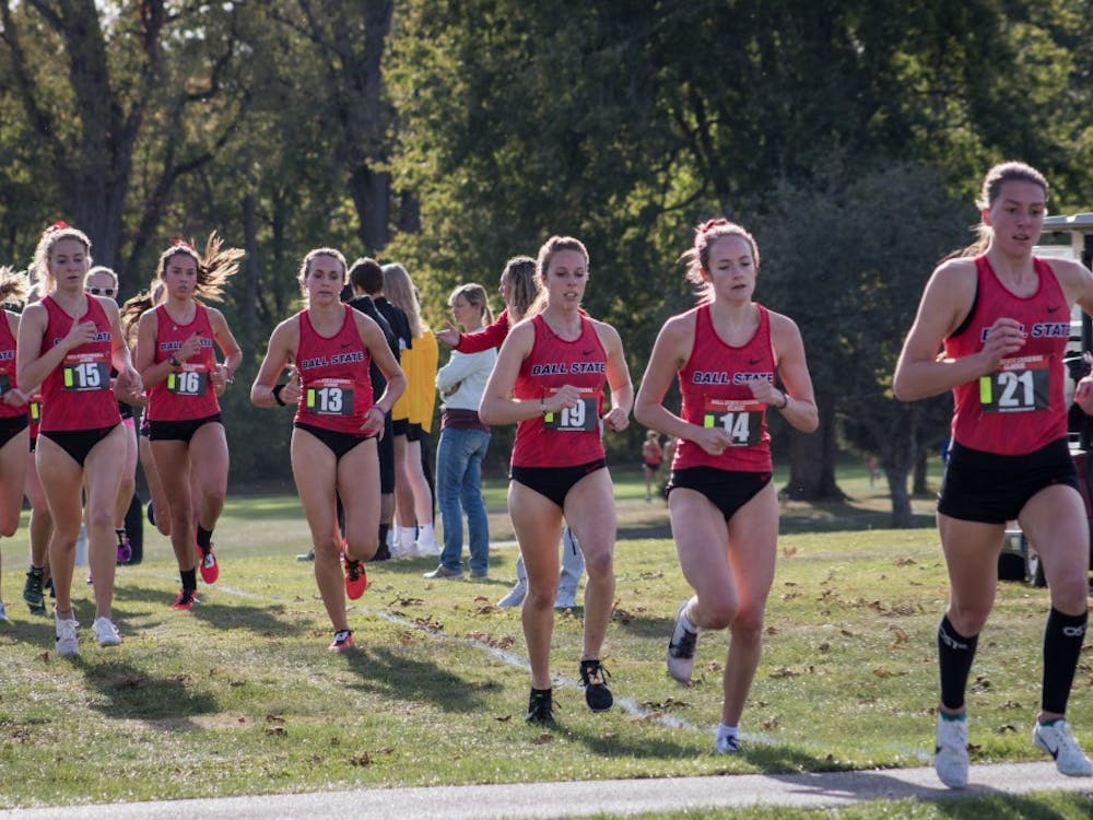 A pack of Ball State Cross Country runners stick together in the first kilometer of their meet Oct. 18, 2019, at the Muncie Elks Golf Club. The Cardinals won with runners finishing in the first six positions. Eric Pritchett, DN