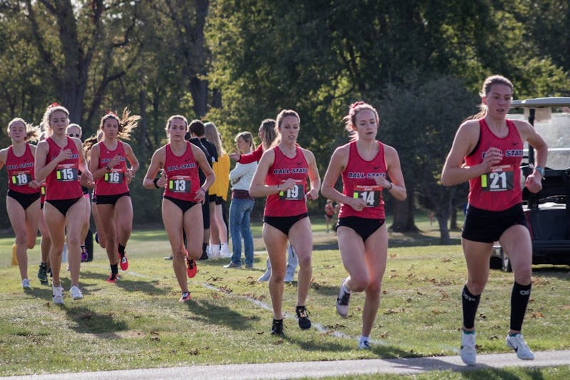 A pack of Ball State Cross Country runners stick together in the first kilometer of their meet Oct. 18, 2019, at the Muncie Elks Golf Club. The Cardinals won with runners finishing in the first six positions. Eric Pritchett, DN