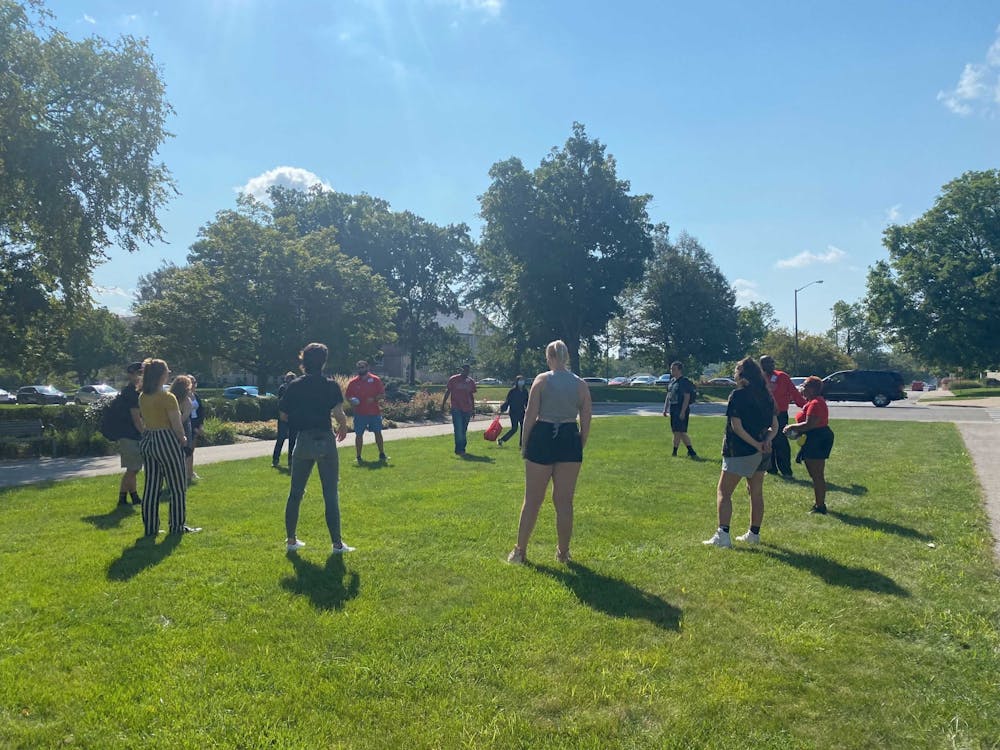 Participants in the "We Soar" Day of Dialogue stand in front of Beneficence Sept. 14. The kickoff event aimed to encourage conversation about diversity in classrooms between faculty, staff and students. Mackenzie Rupp, DN