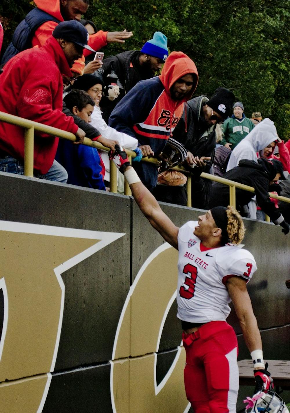 Junior Willie Snead shakes hands with members of the crowd after winning the game against Western Michigan University on Oct. 19 at Waldo Stadium. Ball State won 38-17. DN PHOTO BREANNA DAUGHERTY 