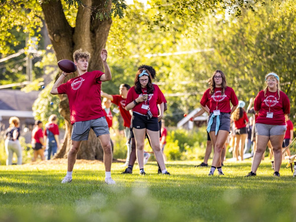 A Ball State student gets ready to throw a football at the Summer Bridge Accelerate dinner Aug. 16 at Bracken House with President Mearns. Samantha Blankenship, Ball State University, Photo Provided