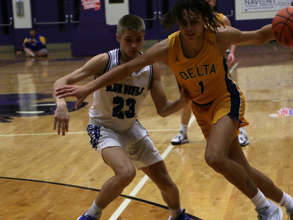 Delta senior D'Amare Hood drives against Tipton. The Eagles lost their first game of the season against Tipton. David Moore, DN