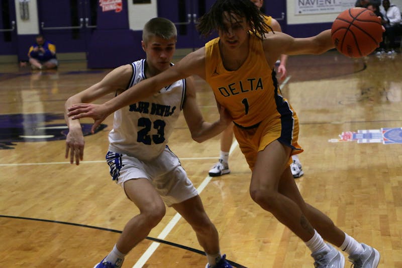 Delta senior D'Amare Hood drives against Tipton. The Eagles lost their first game of the season against Tipton. David Moore, DN