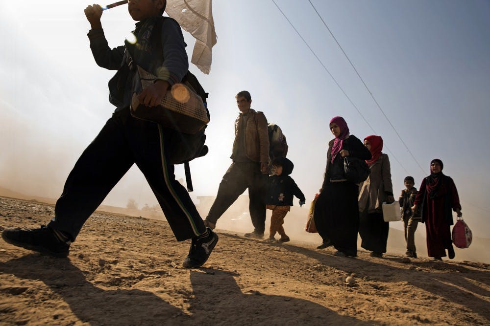 Hundreds of families continue to pour out of the city of Mosul on Nov. 11, 2016 as the fighting continues with little progress being made by the Iraqi Forces against ISIS militants. (Carolyn Cole/Los Angeles Times/TNS)