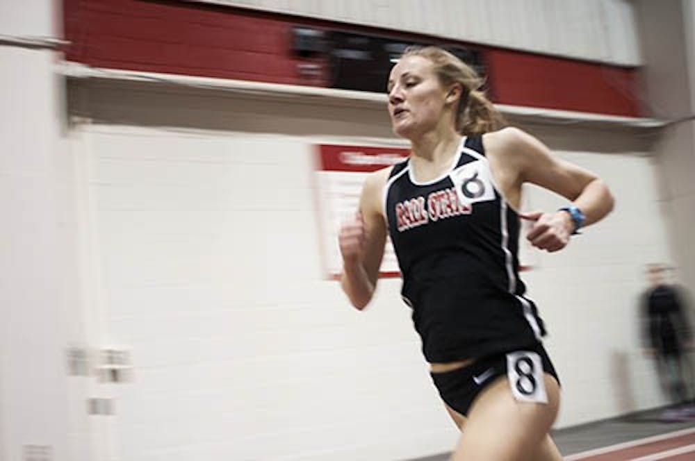 Sophomore Courtney Edons runs in the one mile race during the indoor quad meet.  Edons placed 8th in the event. DN PHOTO JONATHAN MIKSANEK
