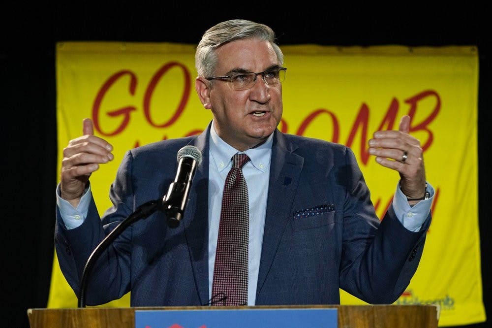 Indiana Gov. Eric Holcomb addresses supporters after winning his second term as governor in Indianapolis, Tuesday, Nov. 3, 2020. (AP Photo/Michael Conroy)