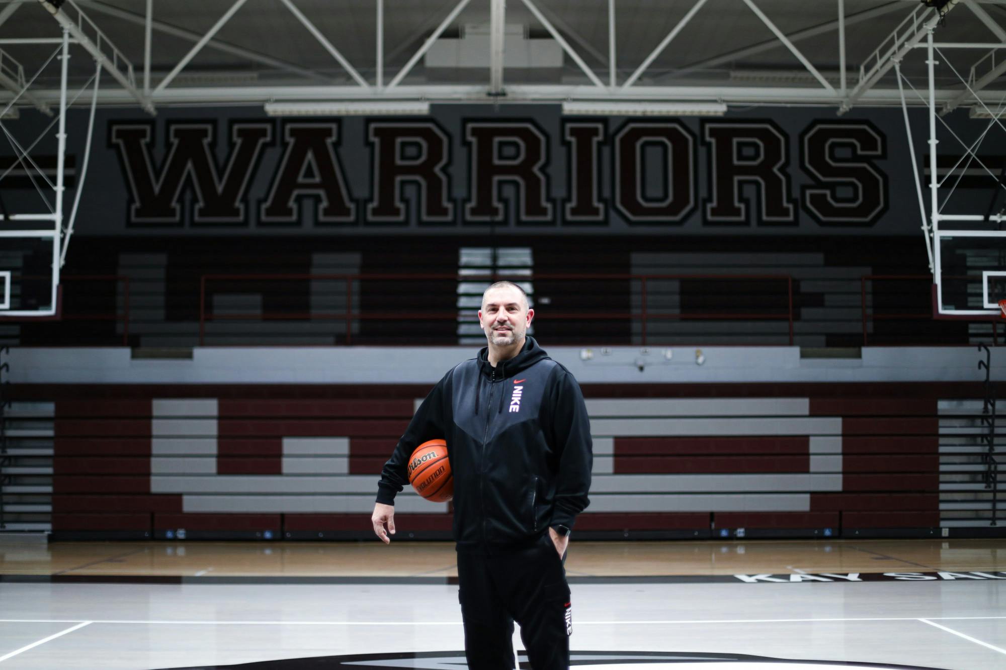 Wes-Del Boys Basketball head coach John McGlothin poses in the gym March 6 at Wes-Del Middle/High School in Gaston, Ind. Jacy Bradley, DN
