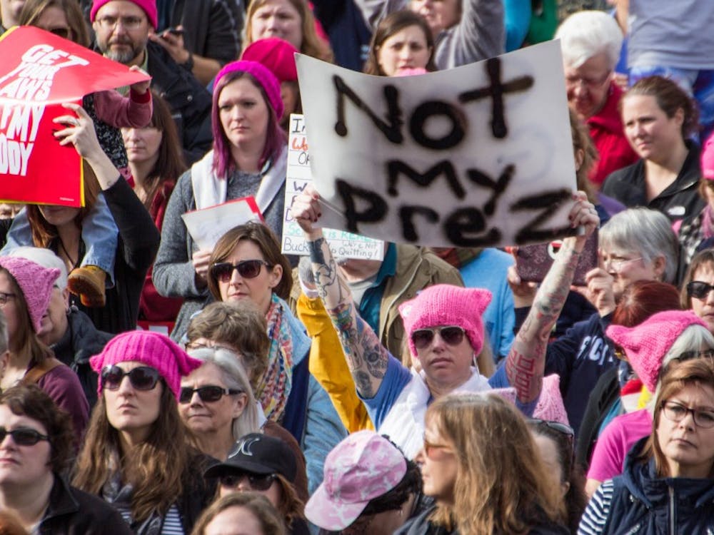 An estimated 4,500 to 5,000 people gathered outside the Indiana Statehouse on Jan. 21 for the Indianapolis Women's March, according to Indiana State Police. The rally was held in conjunction with hundreds of marches nationwide to protest the presidency of Donald Trump and support the rights of women, immigrants, LGBTQ and people of various religions. Grace Ramey // DN