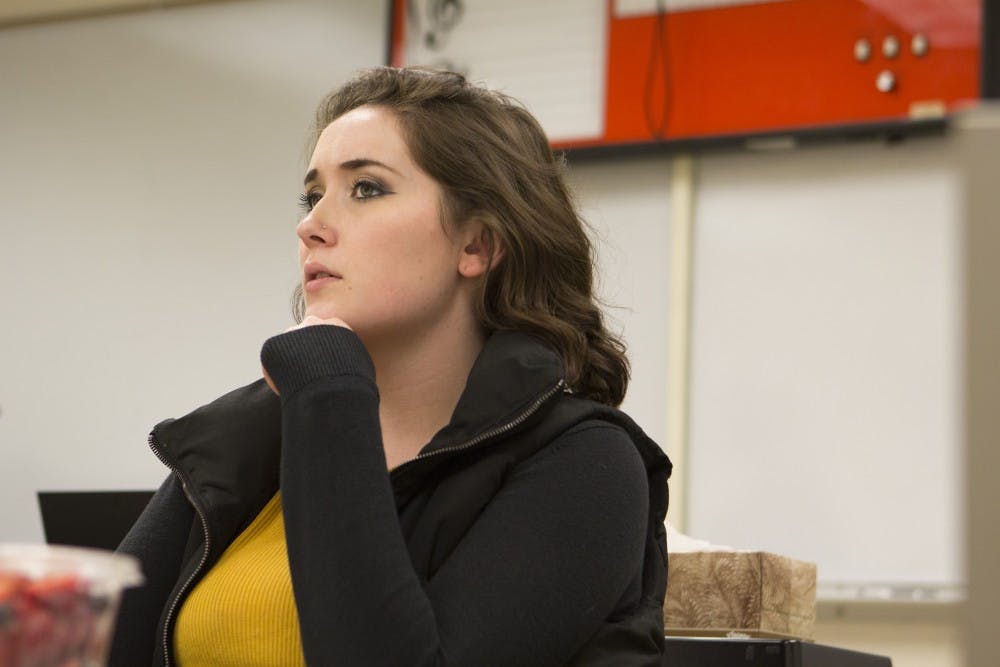 Junior theater education and directing major Baily Fritz watches a rehearsal of "Bully" the night before the show opens. Emma Rogers // DN 
