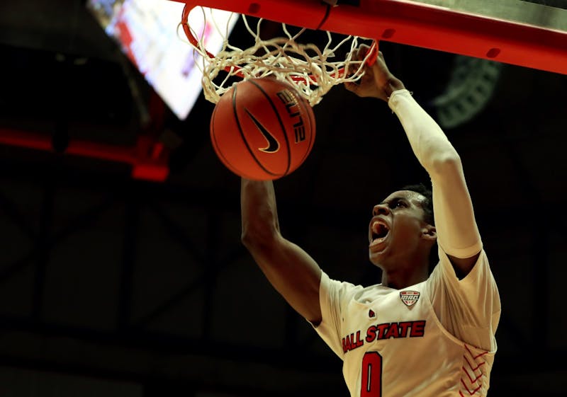 Redshirt junior Miryne Thomas screams after dunking the ball Jan. 29 at Worthen Arena. Rylan Capper, DN 