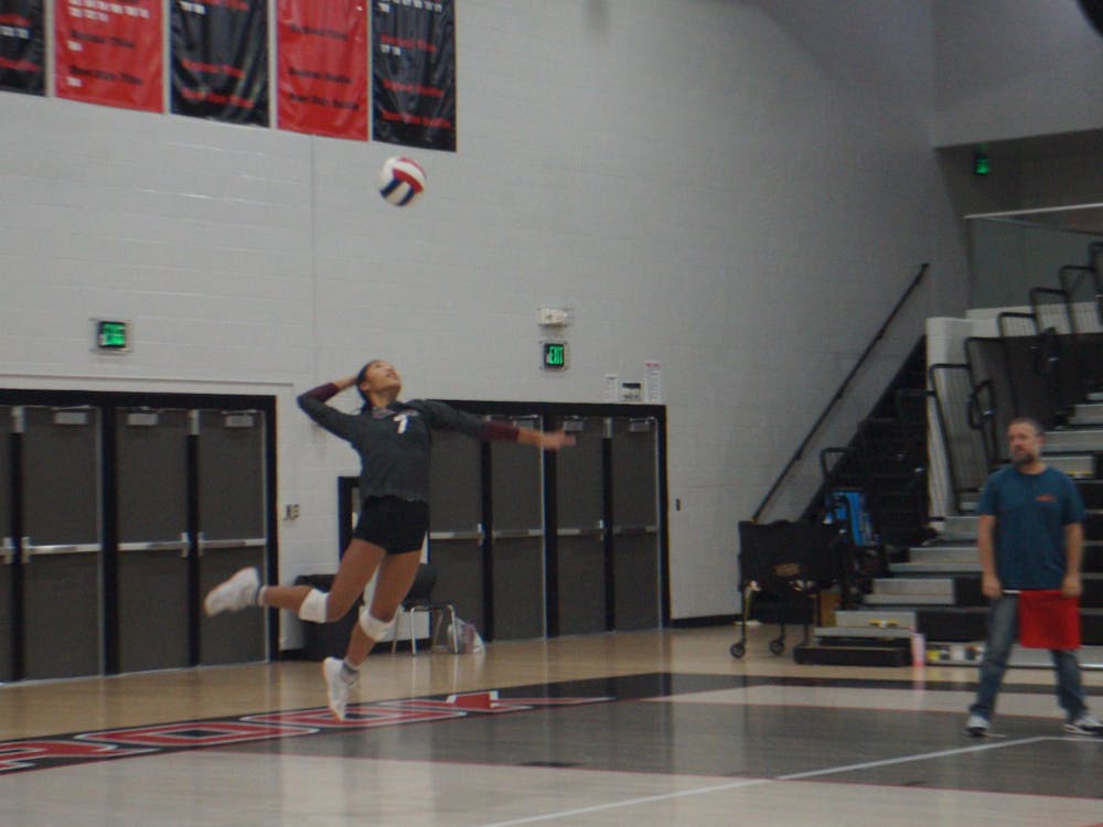 Bearcat teammates show support from the bench when Muncie Central earns a point. Junior Kendall Kahle earned a point for Muncie after spiking the ball for a kill against the Connersville Spartans on Sept. 30, 2025. PHOTO BY MADISON WARD.