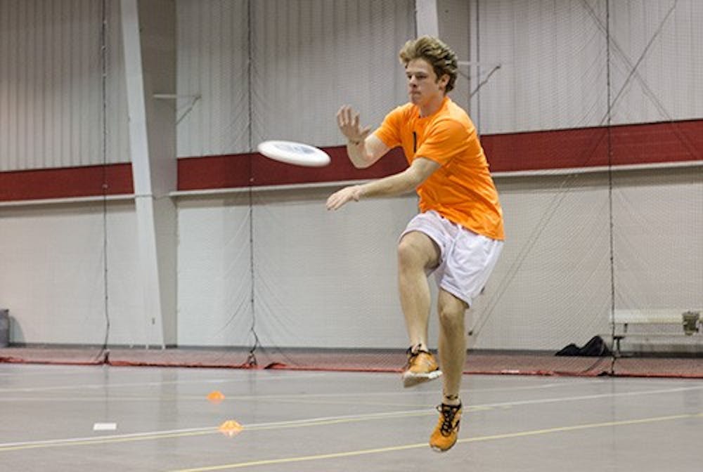 Aquatics and exercise science major Adam Parks practices his catches with the rest of the ultimate frisbee team. The team went to Alabama over the weekend, placing 17 out of 20. DN PHOTO COREY OHLENKAMP