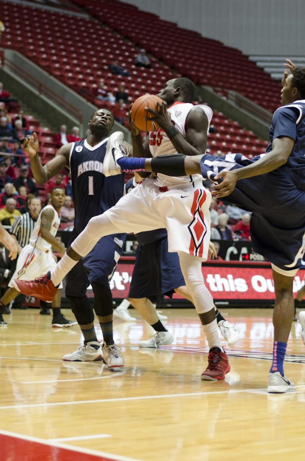 Senior center Majok Majok brings down a rebound in the first half of the game against Akron on Jan. 8 at Worthen Arena. DN PHOTO BREANNA DAUGHERTY