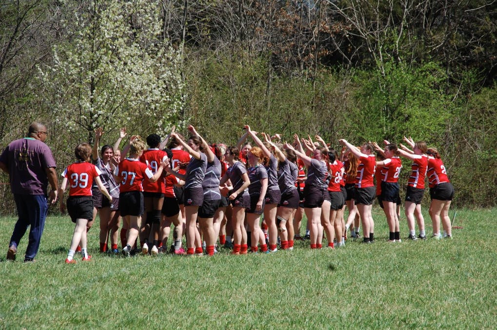 Women’s rugby club huddled