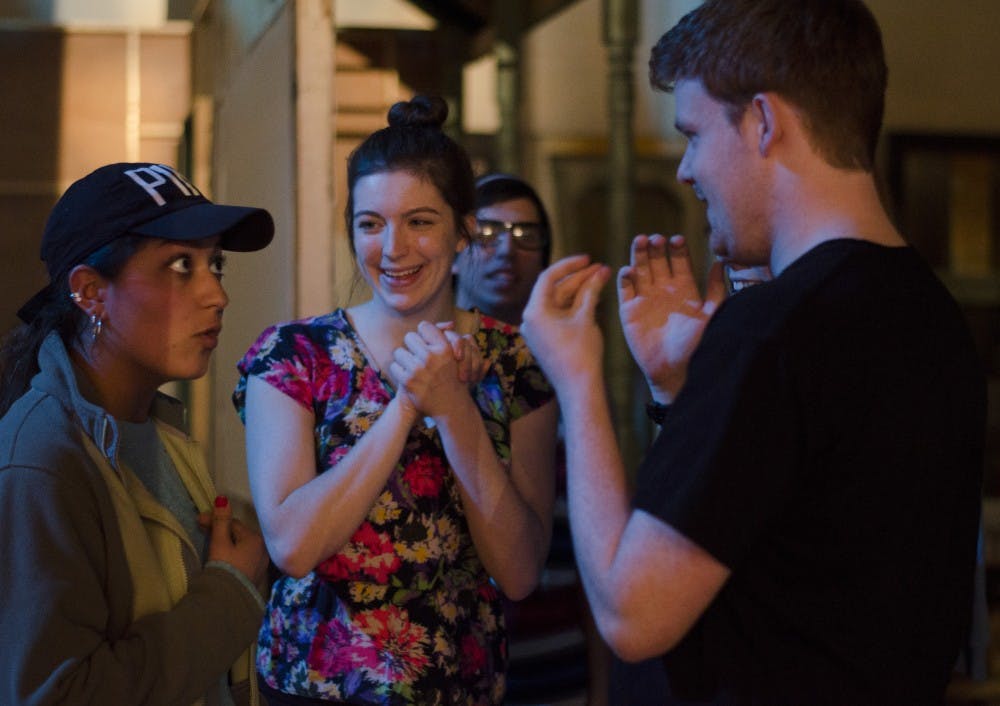 Freshman musical theatre Amanda Boldt talks to sophomore musical theatre major Mikaela Salcedo and freshman musical theatre major Brian Sweeney after practicing one of their songs for 