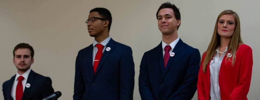 (Left to Right) Nate Woods, Empower Treasuer candidate, Joel Johnson, Empower Vice Presidential candidate, Julian Simmerman, Empower Presidential candidate, and Erin Byrne, Empower Secretarial candidate, stand before the All-Slate Debate Feb. 18, 2019 in the L.A. Pittenger Student Center Ball Room. Scott Fleener, DN&nbsp;