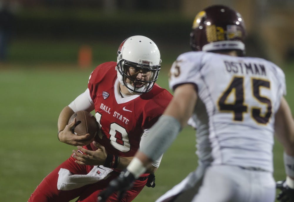 Senior quarterback Keith Wenning takes a quarterback sneak for yard gain for Ball State on Nov. 6. DN PHOTO COREY OHLENKAMP