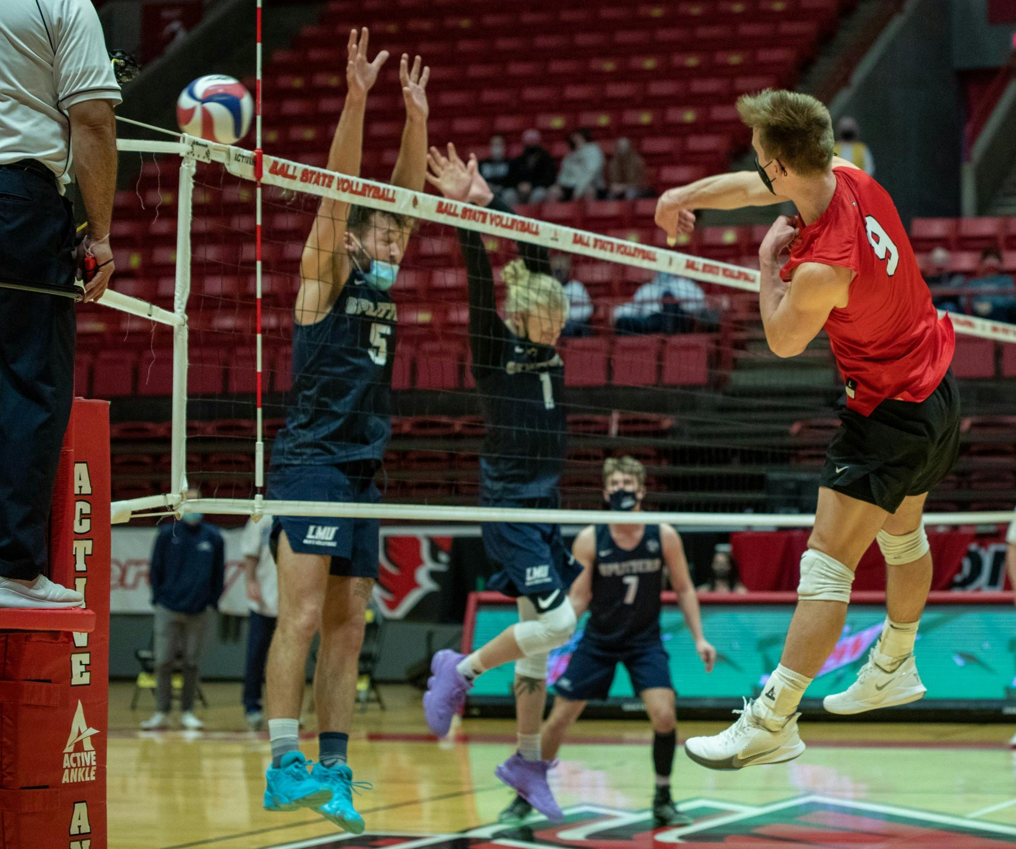 Sophomore outside attacker Bryce Behrendt sends the ball over the net Jan. 29, 2021, in John E. Worthen Arena. Behrendt had 10 kills against Lincoln Memorial University. Jaden Whiteman, DN