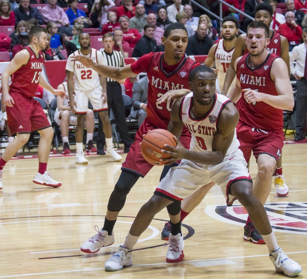 Junior guard Francis Kiapway attempts to pass against Miami on Jan. 10 at Worthen Arena. The Men's Basketball team went on to win 85-74. Terence K. Lightning Jr. // DN