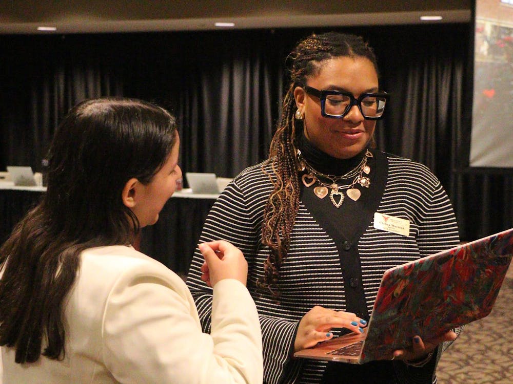 SGA President Chelsea Murdock speaks with Chief Administrator Philena Evett. Landon Jones, DN.