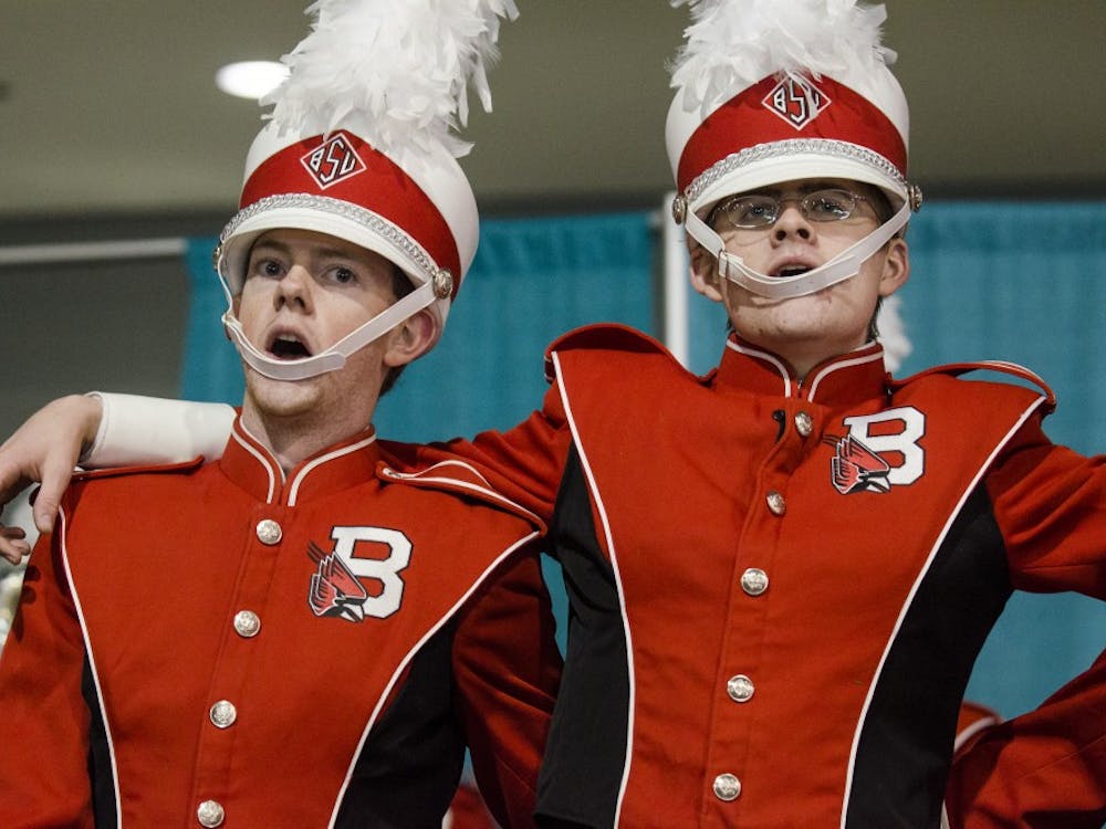 Members of the Pride of Mid-America Marching Band help to rally the crowd during the mayor's luncheon Jan. 3 at the Mobile Convention Center in Mobile, Ala. DN PHOTO COREY OHLENKAMP