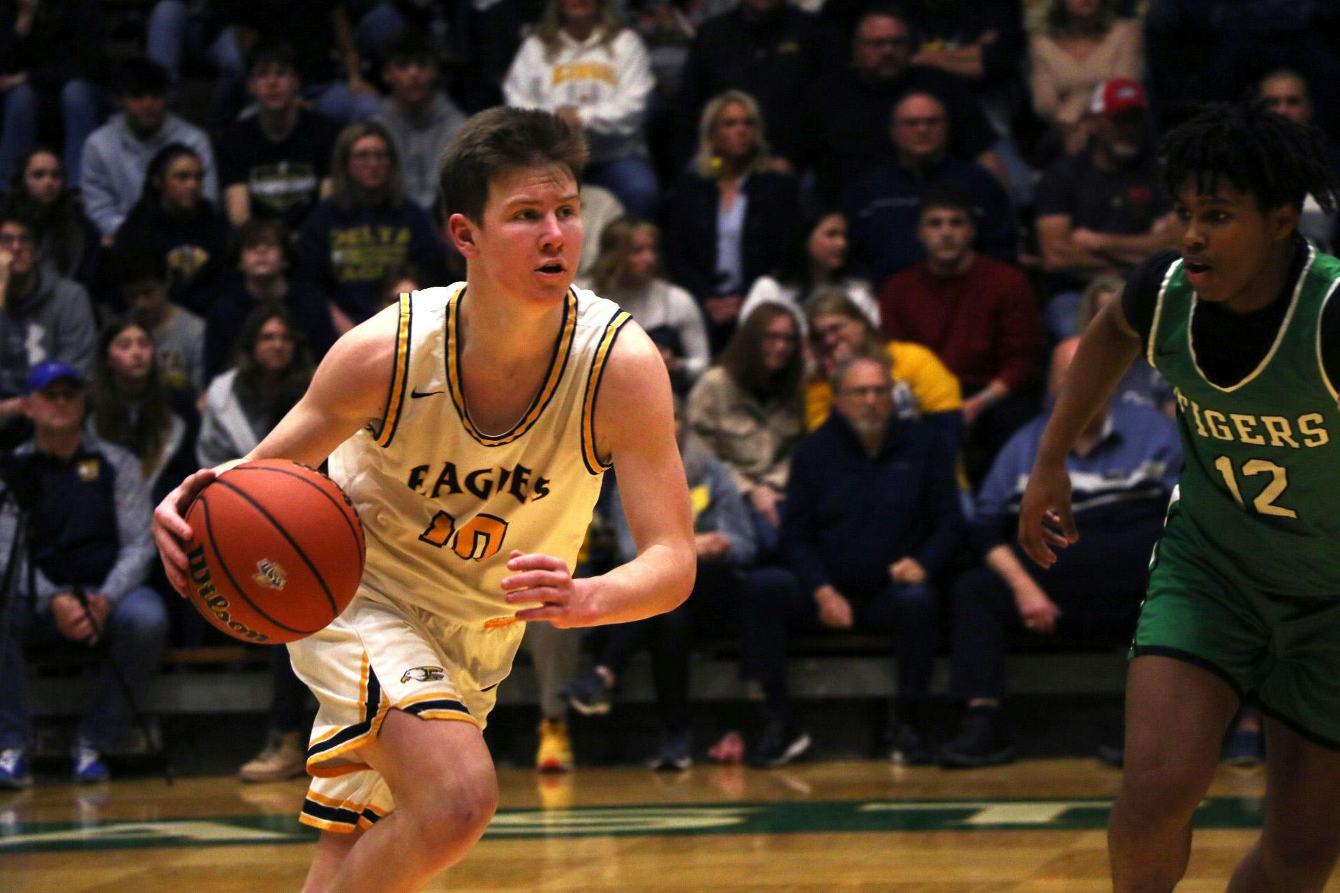 Delta senior Jonny Manor dribbles March 2 in the sectional No. 24 championship game against Yorktown at New Castle High School. Zach Carter, DN.