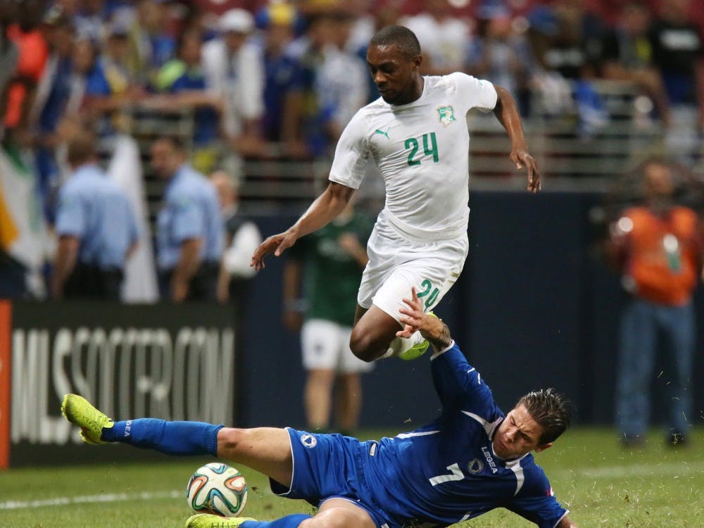Bosnia midfielder Muhamed Besic (7) slides across to block Ivory Coast defenseman Jean-Daniel Akpa Akpro in first-half action in an international friendly on Friday, May 30, 2014, at the Edward Jones Dome in St. Louis. (Chris Lee/St. Louis Post-Dispatch/MCT)