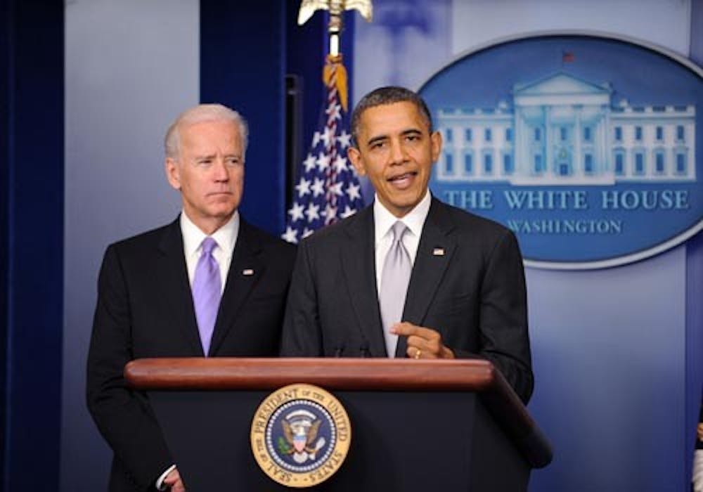 President Barack Obama delivers a statement as Vice President Joe Biden, left, looks on in the Brady Press Briefing Room about the policy process the administration will pursue in the wake of the Newtown, Conn., tragedy Dec. 19 at the White House. Biden has since been appointed to head up the initiative on new gun regulations. MCT PHOTO