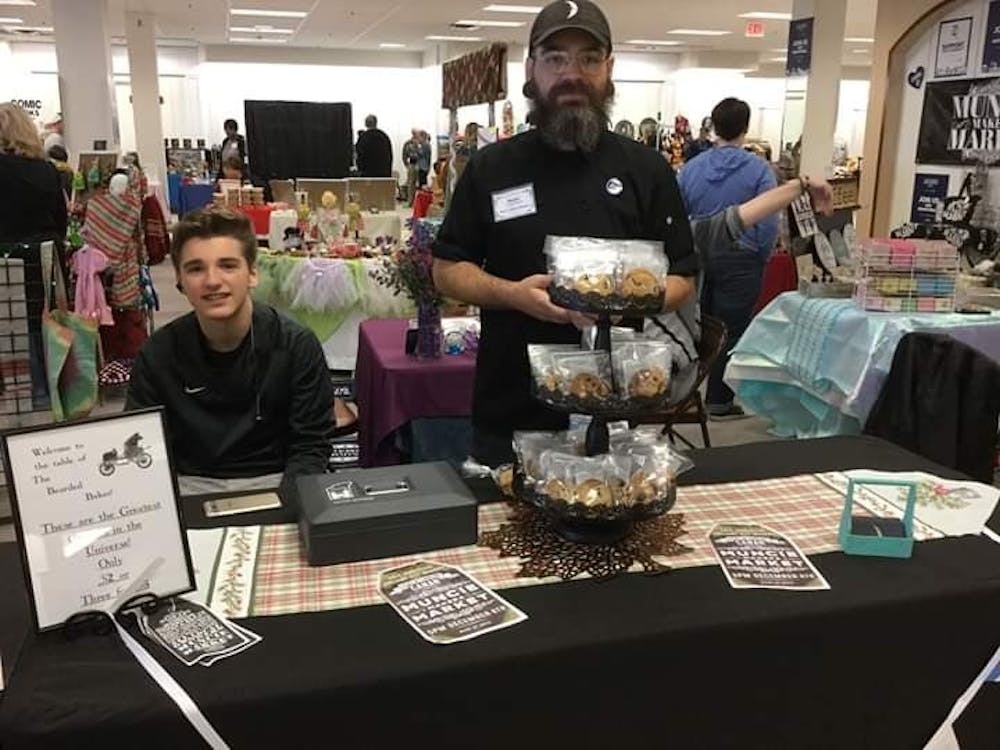 Shane Heath, the owner of The Bearded Baker, sells his baked goods with his son, Ramiel Heath, at the Muncie Makers Market in 2018. Heath said he never did a lot of baking as a child, but his passion for baking started as he came from a family of bakers and realized he could bake well in culinary school. Shane Heath, Photo Provided
