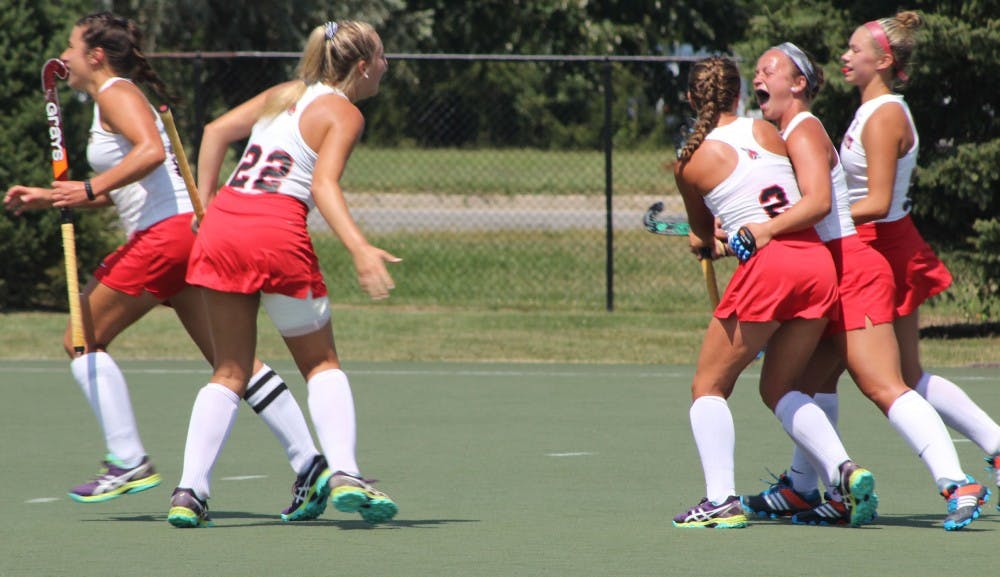 Ball State field hockey players celebrate after senior midfielder Carley Shannon scored a goal in the first half of the Cardinals' game against Ohio on Aug. 27 at Briner Sports Complex. Ball State scored two goals in the first half. Patrick Murphy // DN