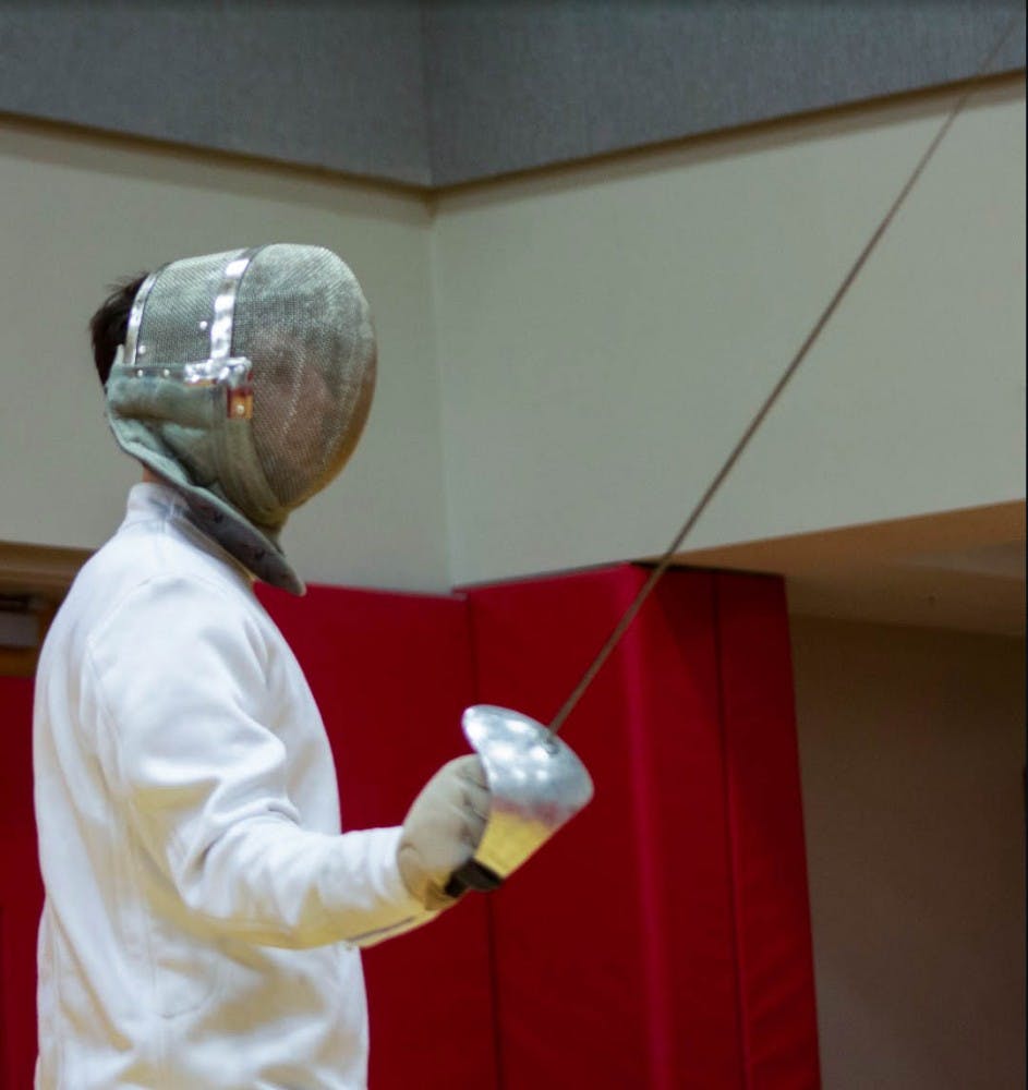 Junior Spencer Deats prepares to take on an opponent during a Ball State fencing club practice at the Ball State Student Recreation and Wellness Center. Patrick Murphy, DN &nbsp;