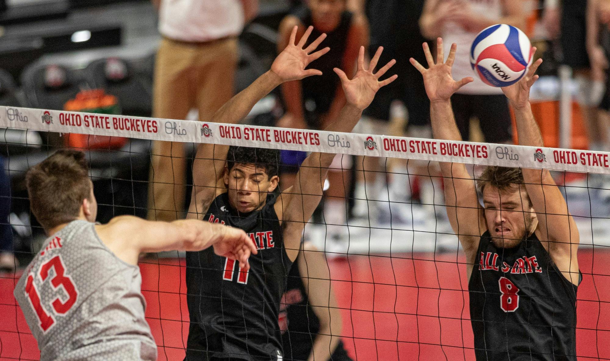 Redshirt junior outside hitter Tyler Alter spikes the ball into senior outside attacker Blake Reardon March 4, 2020, at the Covelli Center in Columbus, Ohio. Reardon had six kills against the Buckeyes. Jacob Musselman, DN