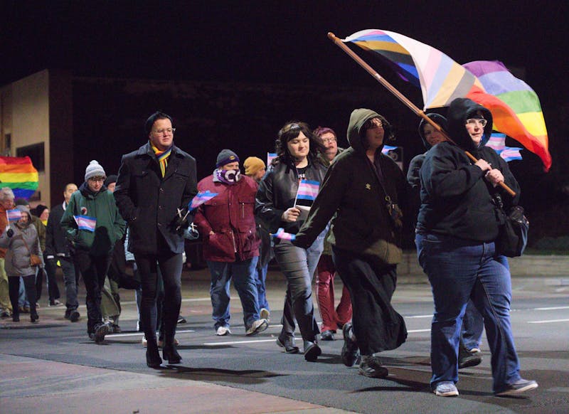 Attendees of the vigil walk through the streets of Muncie, November 11th, 2024. MadJax Maker Force hosted the attendees for refreshments. Jeffrey Dreyer, DN