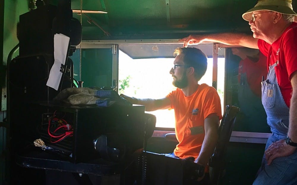 <p>Junior William Cate is also a volunteer train conductor on the train between Indianapolis and Fishers, Ind.  <em>HENDRIX MAGLEY / </em><em>BSU JOURNALISM AT THE FAIR</em></p>